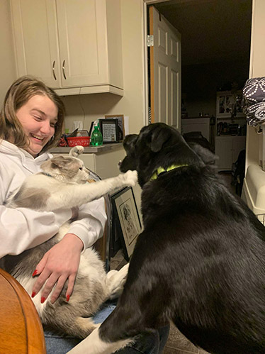 Kendry holding Marie as Marie tries to hit Molly